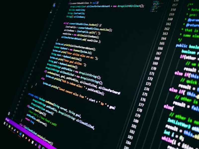 Close-up of colorful programming code on a computer screen, showcasing digital technology.
